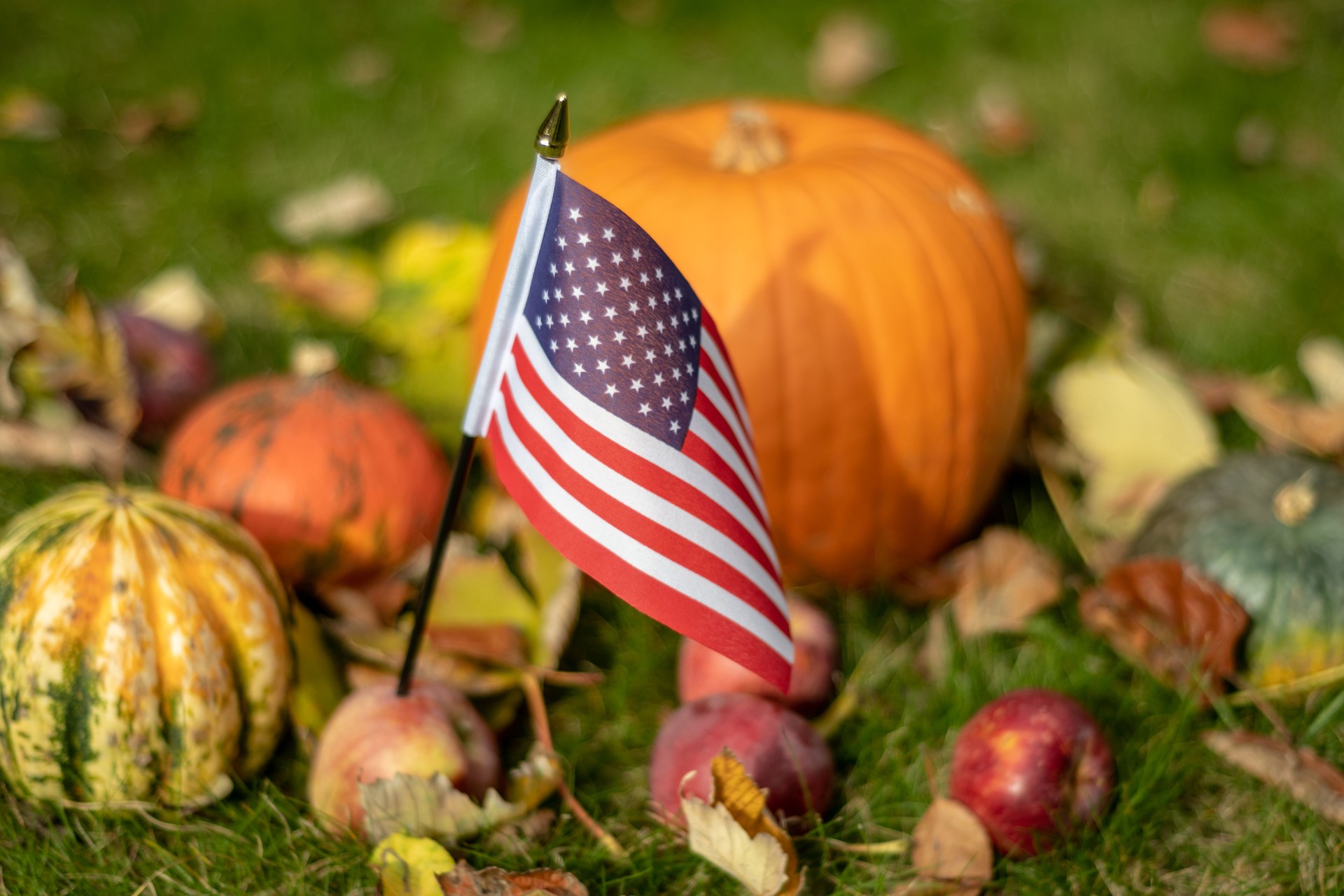 Halloween in USA with stars and stripes flag and pumpkin